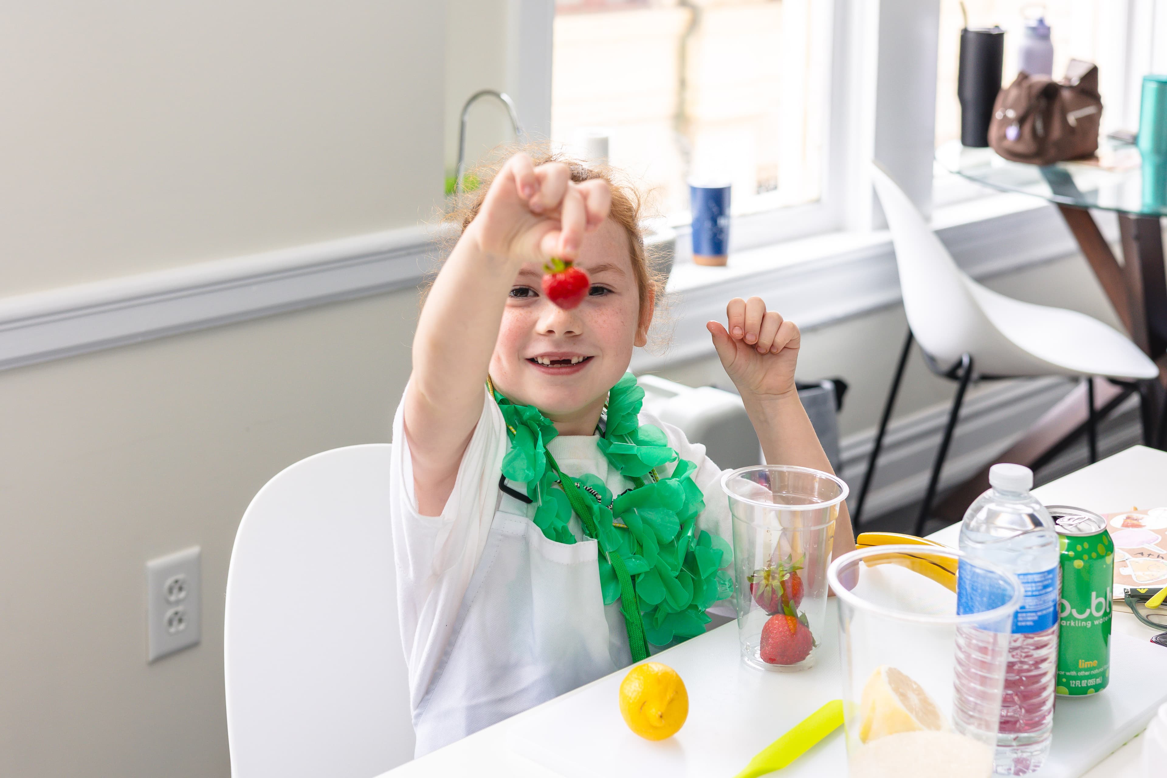 Two young cooks review a recipe together at a kitchen worktable